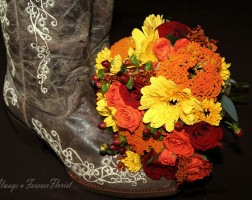 Fall wedding bouquet on cowboy boot