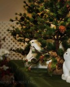 Christmas polar bears around pine tree
