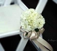 Wedding aisle chair hydrangea arrangement