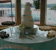 Elegant Four Tier Wedding Cake With Cupcakes