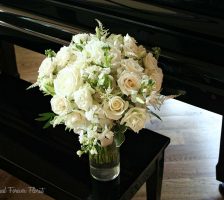 White Bridal Bouquet On Piano Bench