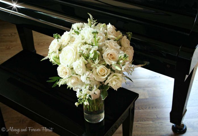 White Bridal Bouquet On Piano Bench