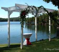 Green Ivy And Red Roses On Wedding Arch