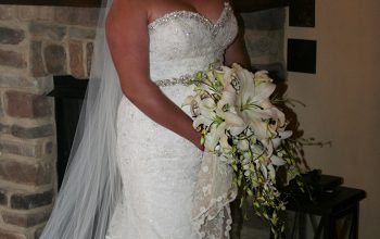 Full Wedding Gown Highlighted With All White Bouquet