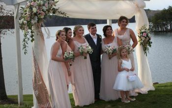 Groom with bridesmaids and flower girl