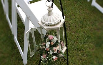 Hanging wedding aisle lantern arrangement