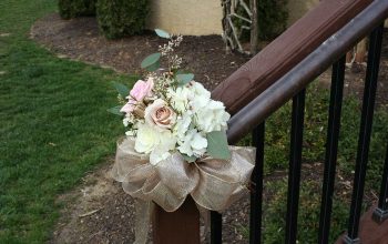 Stair railing rose and hydrangea arrangement