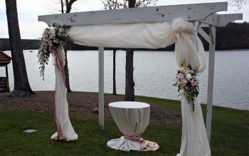 Wedding pergola draping and floral sprays