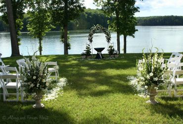 Lakeside wedding with metal pergola