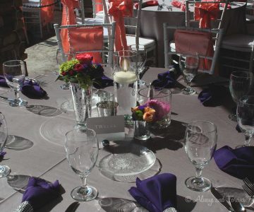 Popping purple napkins along crystal holders