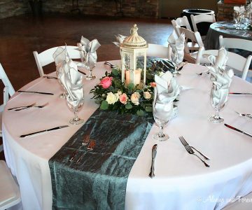 Reception table centerpiece floral ring with lantern