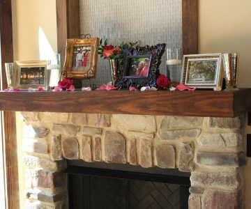 Wedding couple memorabilia on bella fireplace hearth