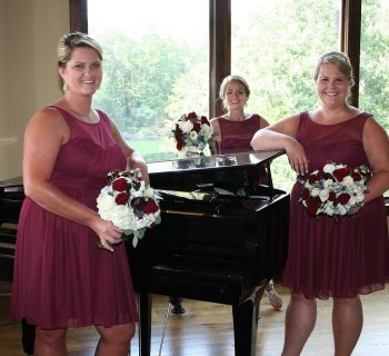 Bridesmaids around bella collina baby grand