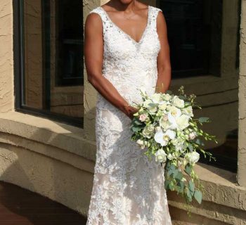 Draping bridal bouquet and bride