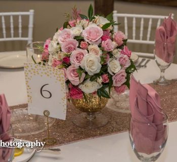 Table six with rose centerpiece