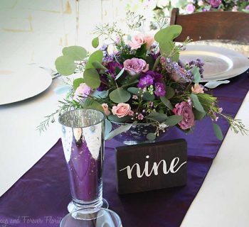 Glass bowl centerpiece arrangement for reception table