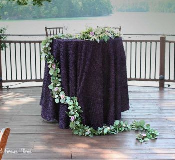 Organic ruscus runner for head table