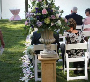 Wedding aisle flower urns