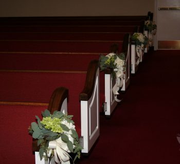 Church pew floral adornments