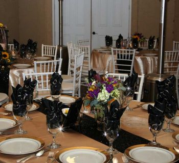 Dazzling blacks and satins reception setup