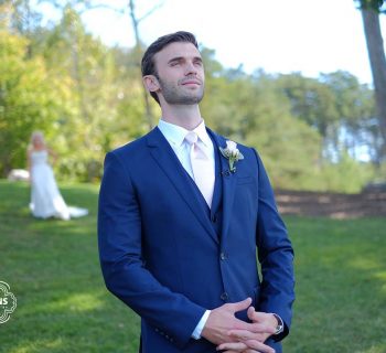 Groom musing by the lake